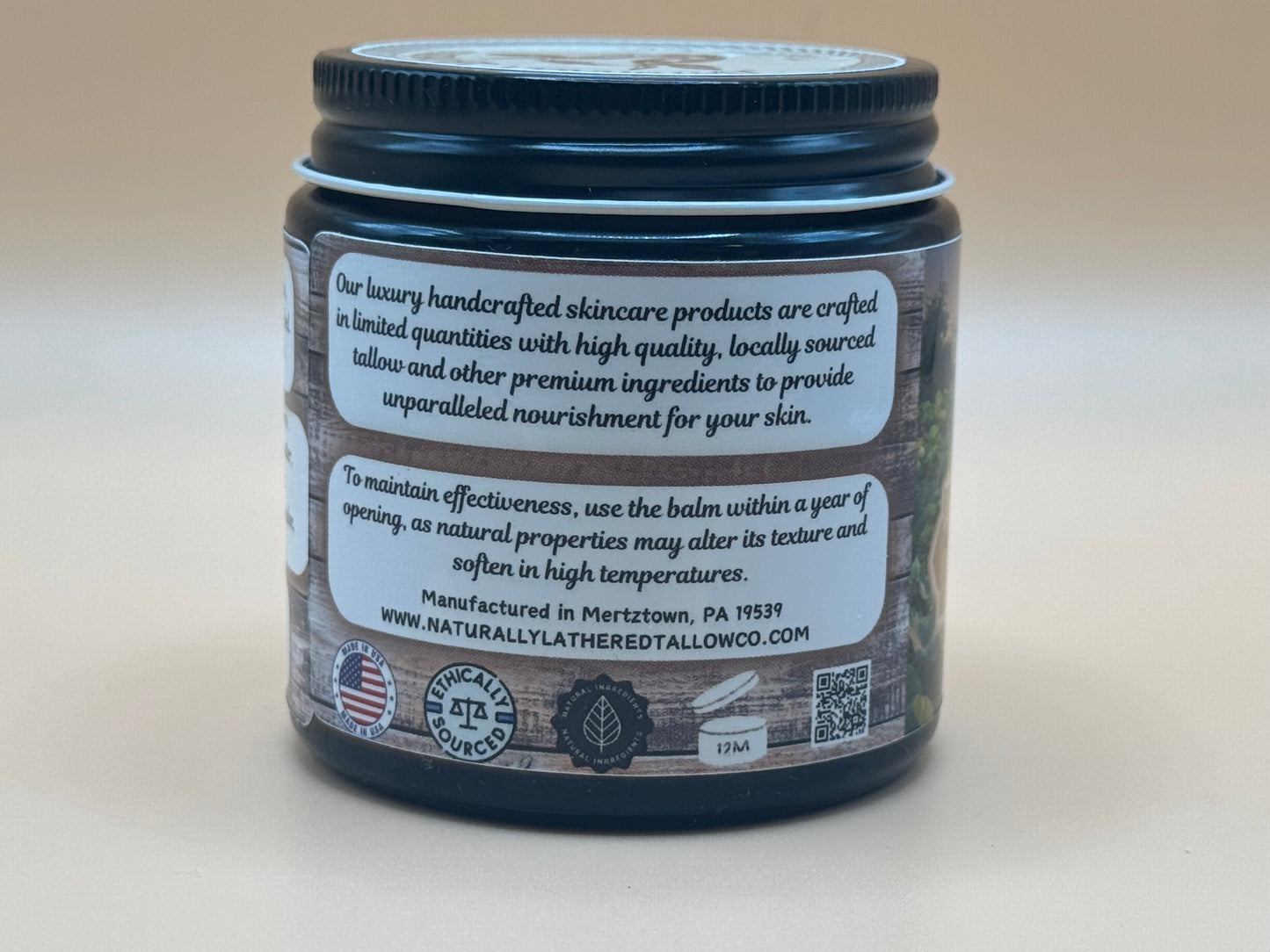 Skincare balm jar with label on a beige background