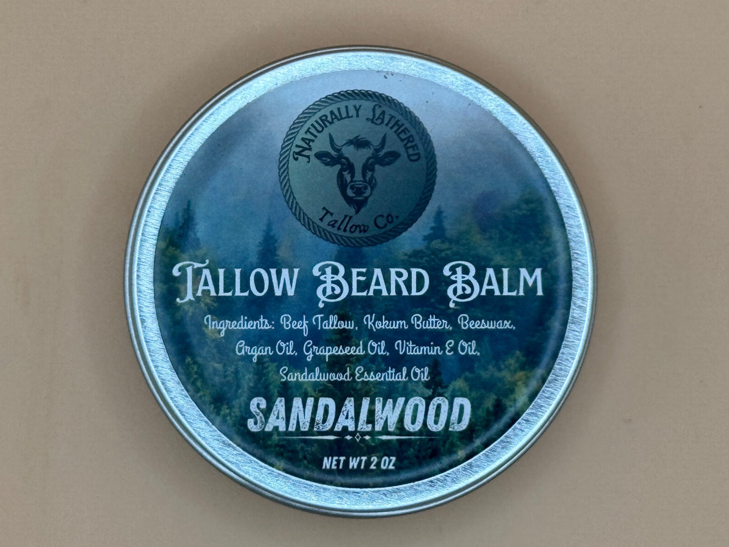 Tallow beard balm container with sandalwood scent on a beige background