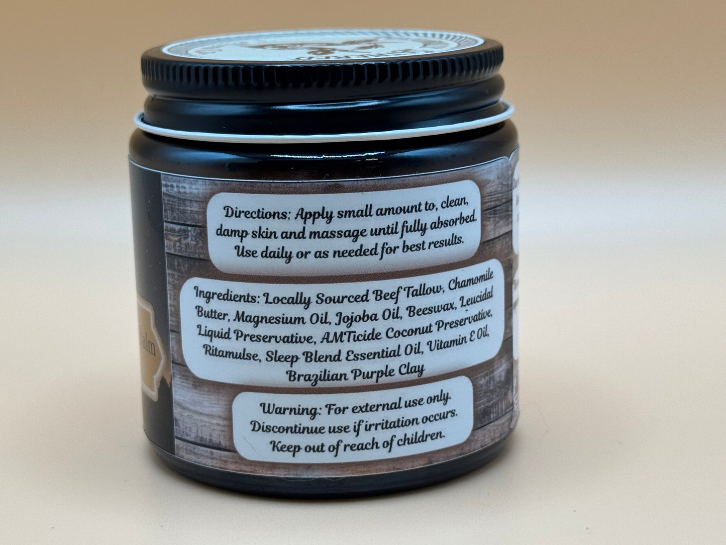 Jar of cream with label on a beige background