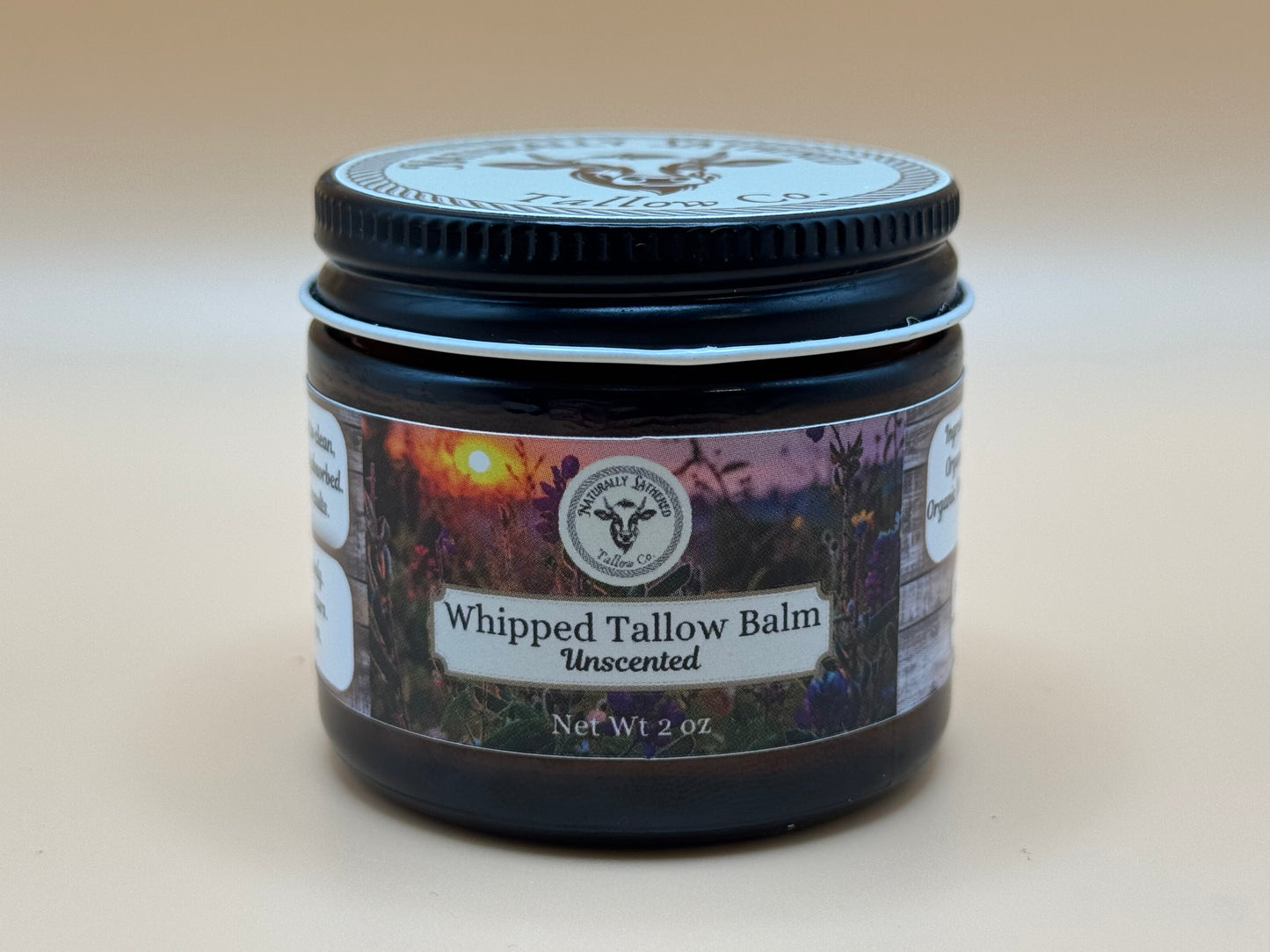Jar of Whipped Tallow Balm on a beige background